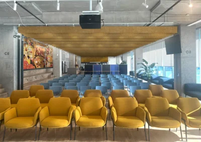 Atrium Acoustic Optimization – The open atrium with exposed concrete ceilings was reimagined to address acoustic challenges. Wall-mounted felt panels and sculpted ceiling baffles were integrated as both functional and aesthetic elements, shaping a quieter and more engaging space.
